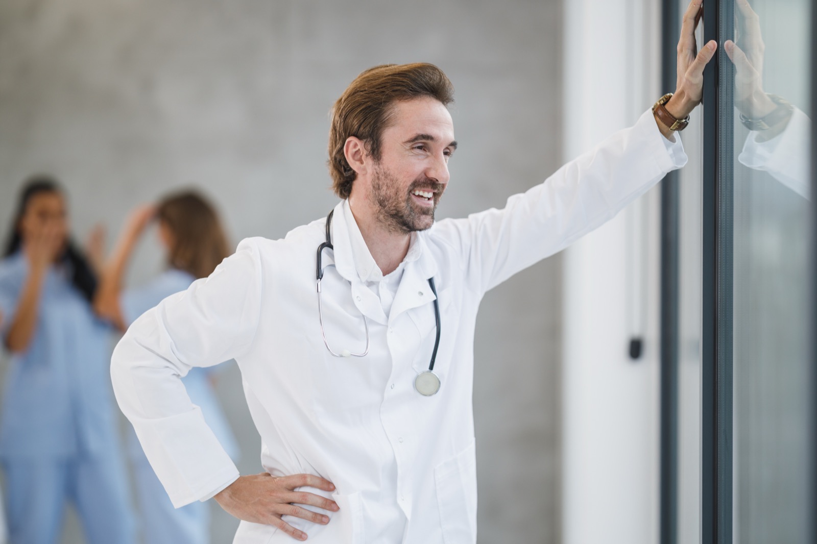 A doctor smiling with colleagues