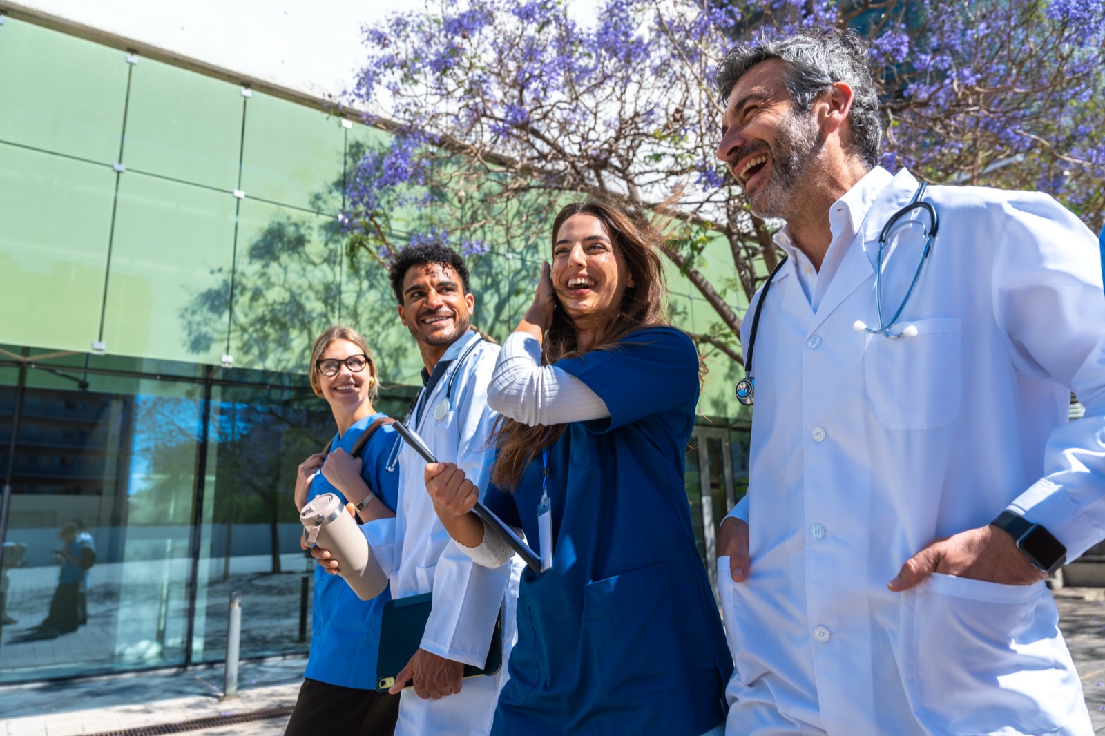 A clinic team walking and laughing outside